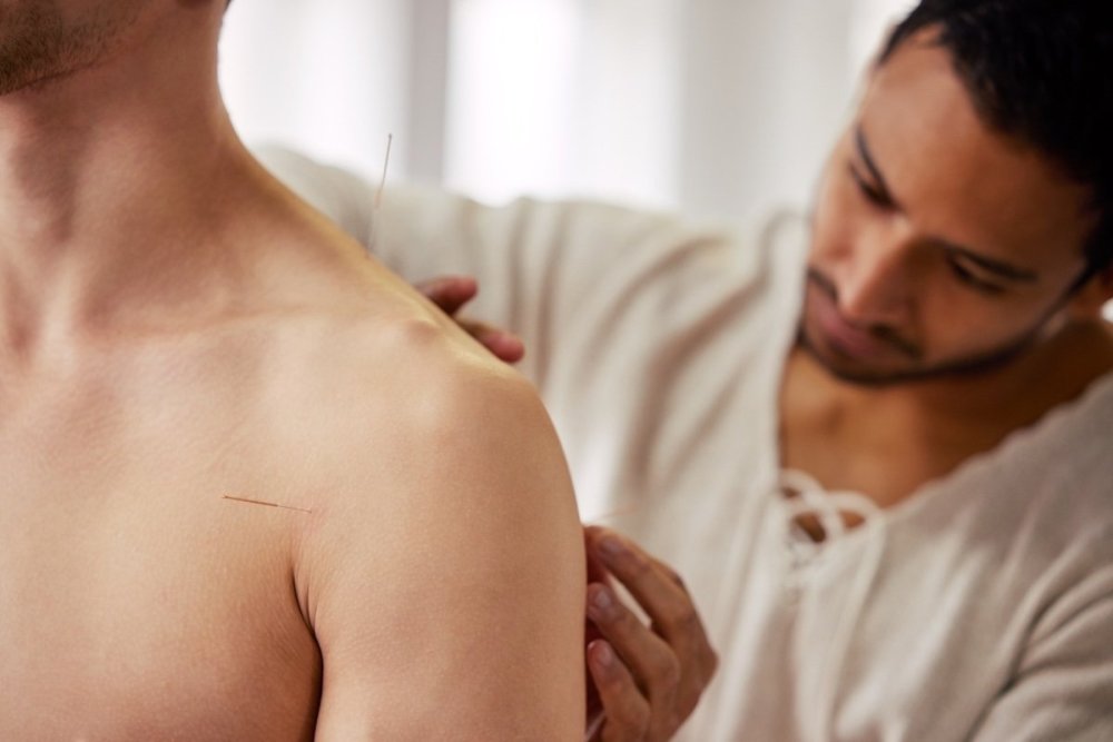 man-receiving-acupuncture-energy-healing.jpg