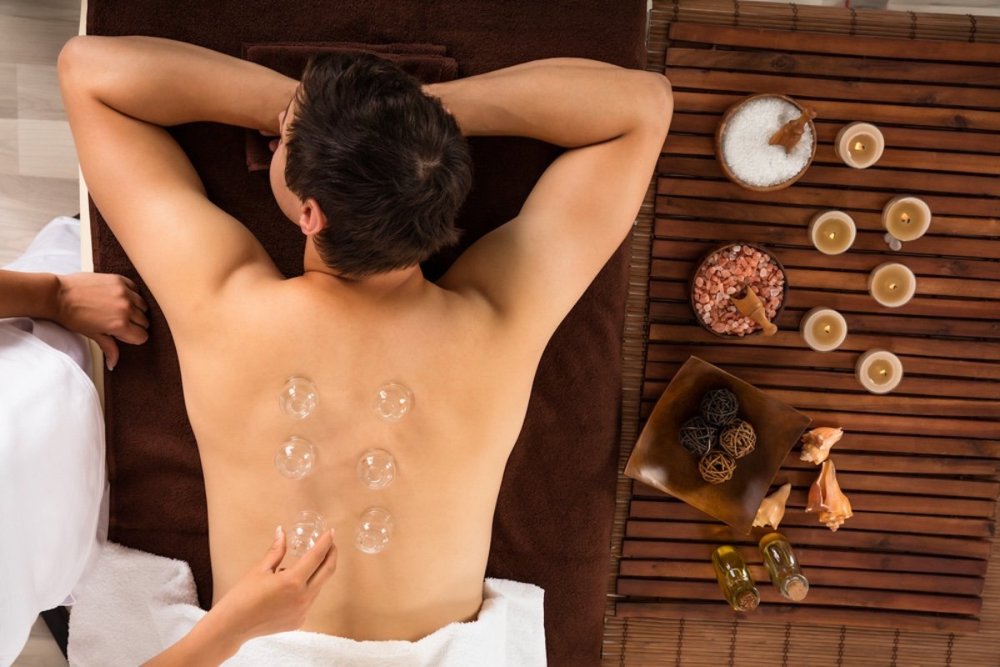 man-balancing-chi-energy-cupping-therapy.jpg
